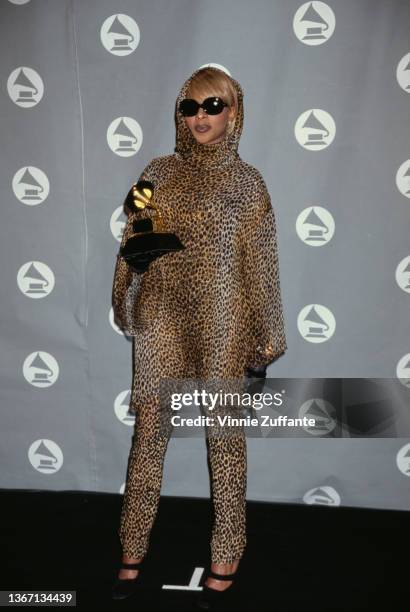 American singer and songwriter Mary J Blige, wearing a leopard print outfit with headscarf and sunglasses, in the press room of the 38th Annual...