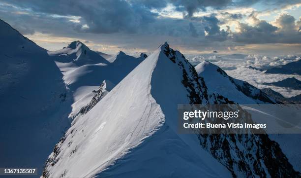 snow covered peaks in the monte rosa massif. - monte rosa fotografías e imágenes de stock