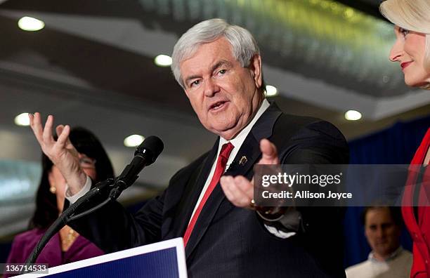 Republican presidential candidate, former Speaker of the House Newt Gingrich speaks at his party on primary night as his wife Callista Gingrich looks...