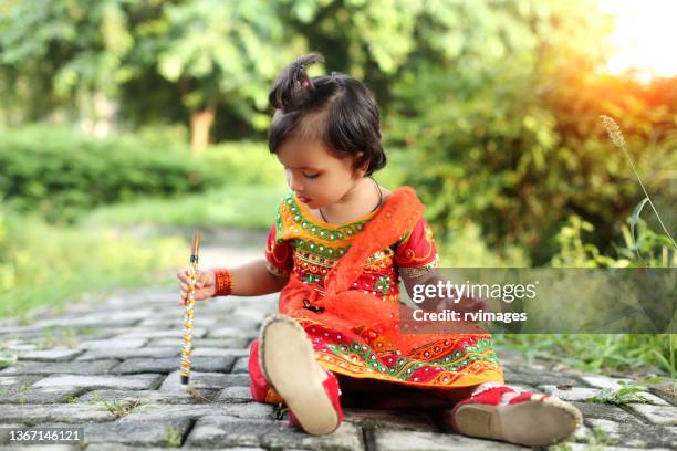 cute girl in radha costume on janmashtami festival - krishna janmashtami stock pictures, royalty-free photos & images