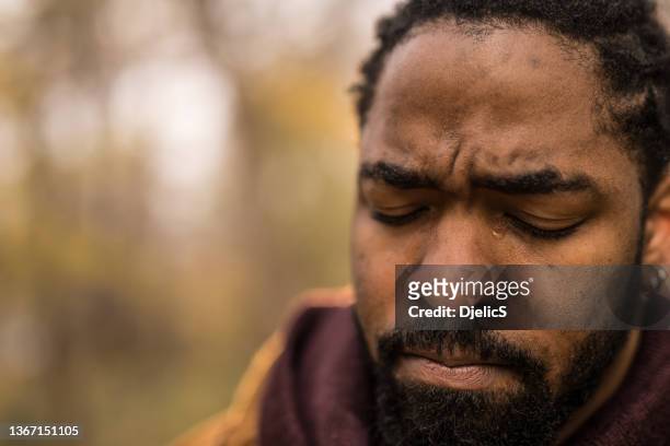 crying african american man having life's difficulties. - man crying tears stock pictures, royalty-free photos & images