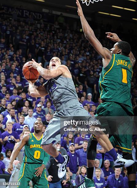 Guard Angel Rodriguez of the Kansas State Wildcats drives to the basket against center Perry Jones III of the Baylor Bears during the second half on...