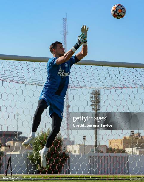 Goalkeeper Karl Darlow jumps to save the ball during the Newcastle United training session at the Ittihad FC training ground on January 27, 2022 in...