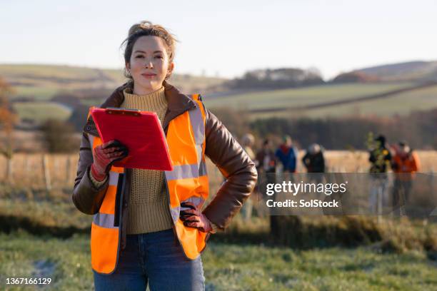 leading a community conservation group - rural community stock pictures, royalty-free photos & images