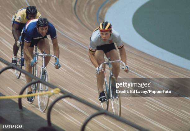 From left, Stanley Smith of Barbados, Daniel Morelon of France and Michel Vaarten of Belgium compete in 1/8 final 1 of the Men's sprint cycling event...