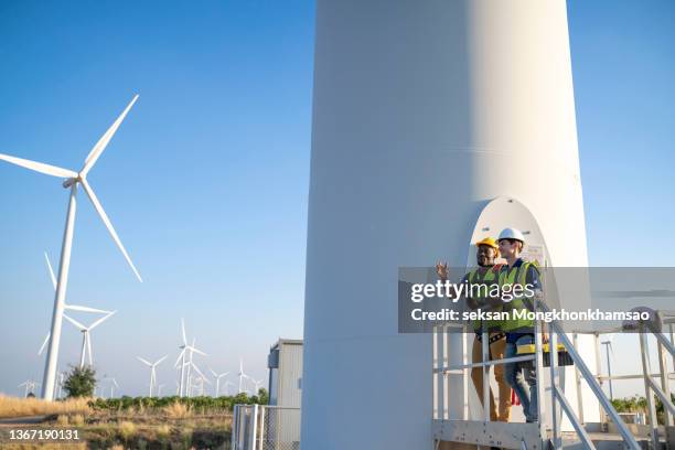 team of inspection engineers prepares and conducts a wind turbine safety inspection on a wind farm in thailand. - wind power station stock pictures, royalty-free photos & images