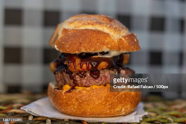 sandwich,close-up of burger on table,state of bahia,brazil - barbeque sauce stock pictures, royalty-free photos & images