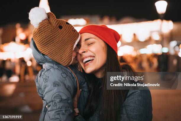 mom and son at amusement park - playground equipment happy parent stock pictures, royalty-free photos & images