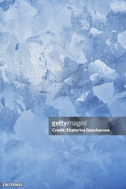abstract blue background of ice, frozen glass. - frosty foto e immagini stock