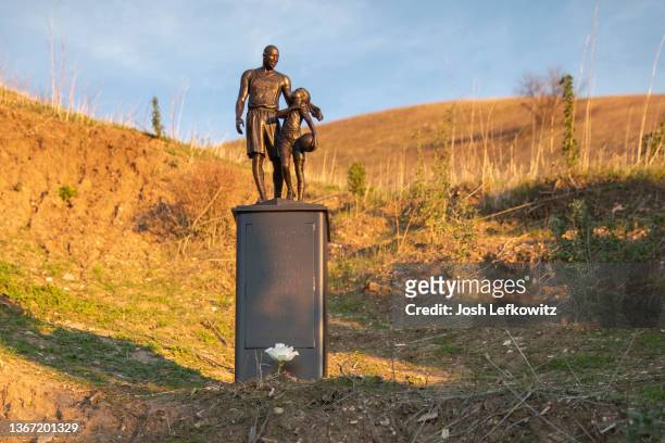 Artist Dan Medina's bronze sculpture depicting Kobe Bryant, daughter Gianna Bryant, and the names of those who died, is displayed as a one-day...
