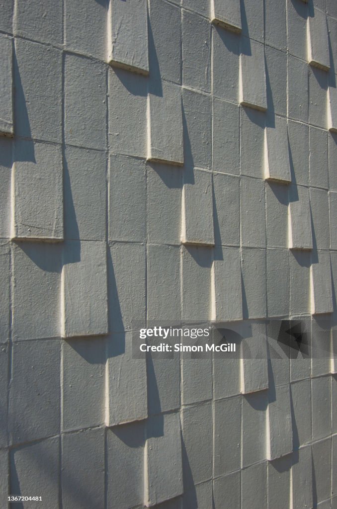 Brick Feature Wall With A Slanted Protruding Design Painted White High ...