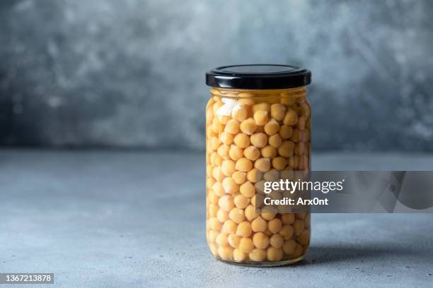 canned chickpeas in brine - chickpea stock pictures, royalty-free photos & images