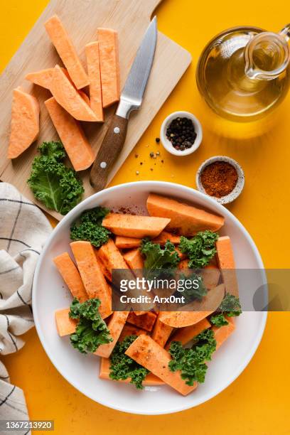 sweet potato wedges preparation - baked sweet potato stock pictures, royalty-free photos & images
