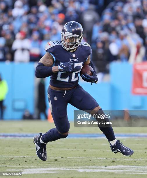 Derrick Henry of the Tennessee Titans runs against the Cincinnati Bengals during the AFC Divisional Playoff at Nissan Stadium on January 22, 2022 in...