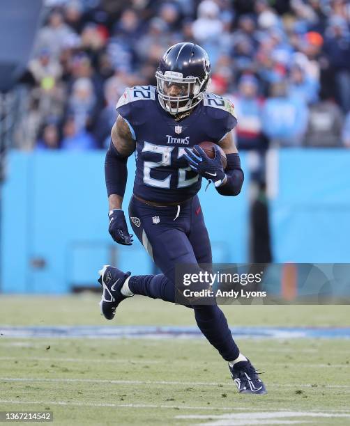 Derrick Henry of the Tennessee Titans runs against the Cincinnati Bengals during the AFC Divisional Playoff at Nissan Stadium on January 22, 2022 in...