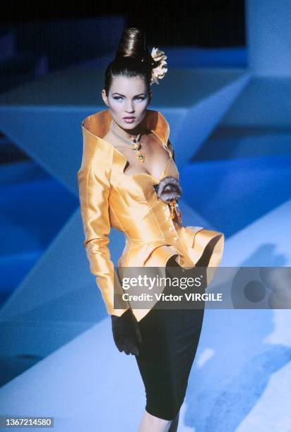 Kate Moss walks the runway during the Thierry Mugler Ready to Wear Fall/Winter 1995-1996 fashion show as part of the Paris Fashion Week on March 6,...