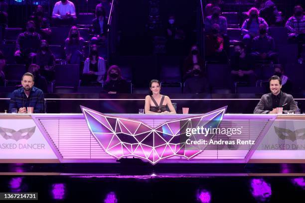 Steven Gätjen, Yvonne Catterfeld and Alexander Klaws seen on stage during the final episode of tv show "The Masked Dancer" at MMC Studios on January...