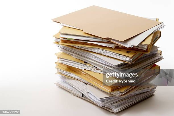 isolated shot of stacked file folders on white background - heap 個照片及圖片檔