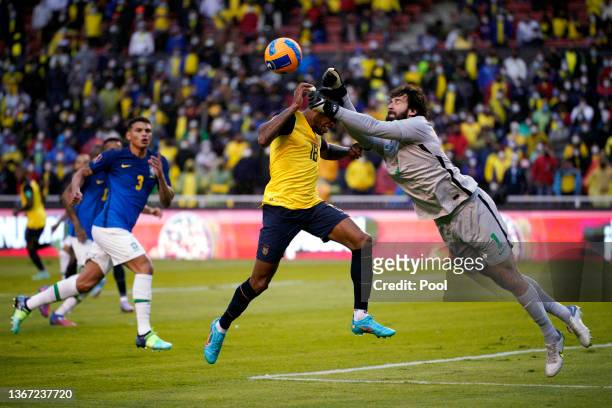 Alisson Becker of Brazil collides with Ayrton Preciado of Ecuador during a match between Ecuador and Brazil as part of FIFA World Cup 2022 Qatar...