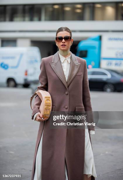 Guest is seen wearing wool coat, Fendi bag, sunglasses, white button shirt, socks, Fendi heels outside Fendi during Paris Fashion Week - Haute...