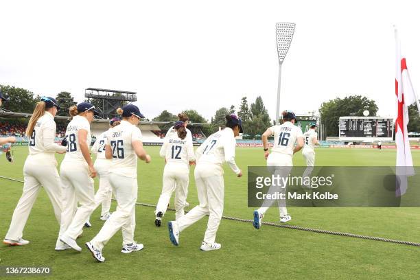 The England team take the field during day two of the Women's Test match in the Ashes series between Australia and England at Manuka Oval on January...