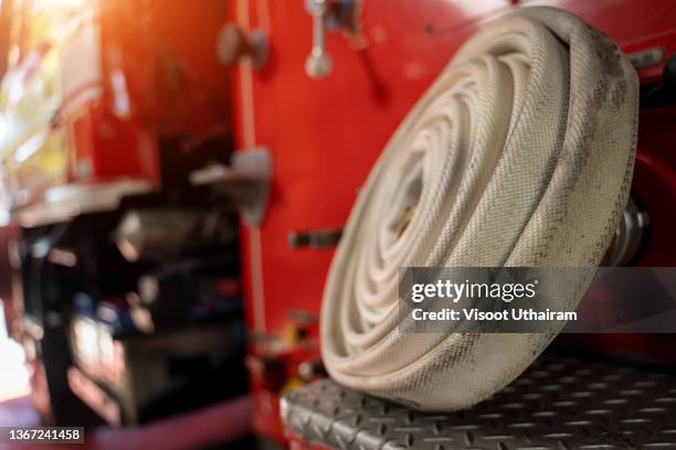 fire hose on the bumper of the fire truck,fire hose nozzle. - fire department of the city of new york foto e immagini stock