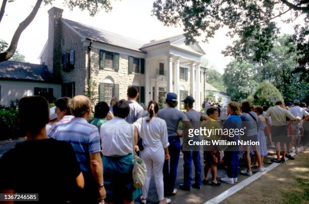 Fans line up to pay their respects, leave gifts, flowers and decorations at the gravesite of Elvis Presley prior to the 10th Anniversary of his death...
