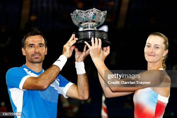 Ivan Dodig of Croatia and Kristina Mladenovic of France pose with the champions trophy after winning the Mixed Doubles Final against Jaimee Fourlis...