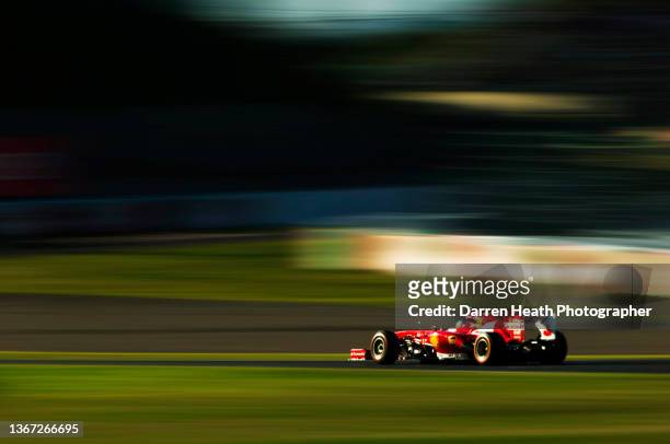 Spanish Scuderia Ferrari Formula One team racing driver Fernando Alonso driving his F138 racing car at speed through Turn Three, the first of the 'S'...
