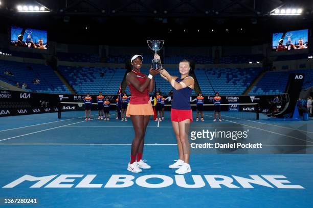 Clervie Ngounoue of United States and Diana Shnaider of Russia pose with the champions trophy after winning the Junior Girl's Doubles Final match...