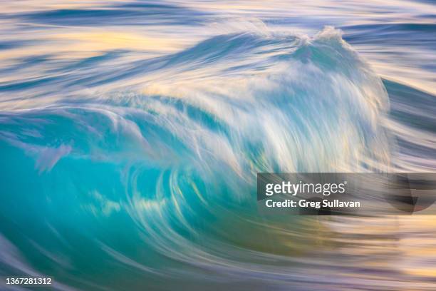 a single slow shutter photograph of a wave - slow shutter stock pictures, royalty-free photos & images