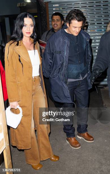 Orlando Bloom and Katy Perry depart Carbone Restaurant on January 28, 2022 in New York City.