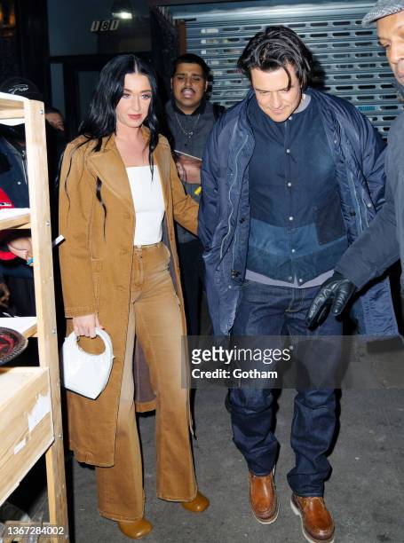 Orlando Bloom and Katy Perry depart Carbone Restaurant on January 28, 2022 in New York City.