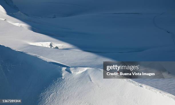 climber on a snowy ridge - minimal effort stock pictures, royalty-free photos & images