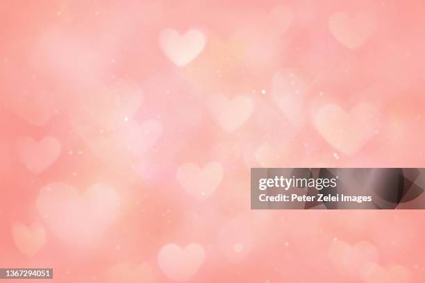 defocused pink background with heart shapes - valentines background fotografías e imágenes de stock