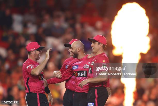 Nathan Lyon of the Sydney Sixers celebrates taking the wicket of Mitchell Marsh of the Scorchers during the Men's Big Bash League match between the...