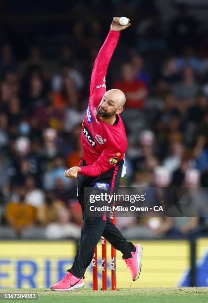 Nathan Lyon of the Sixers bowls during the Men's Big Bash League match between the Perth Scorchers and the Sydney Sixers at Marvel Stadium, on...