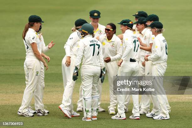 Alana King of Australia celebrates with her team after the DRS confirmed the wicket of Katherine Brunt of England during day two of the Women's Test...