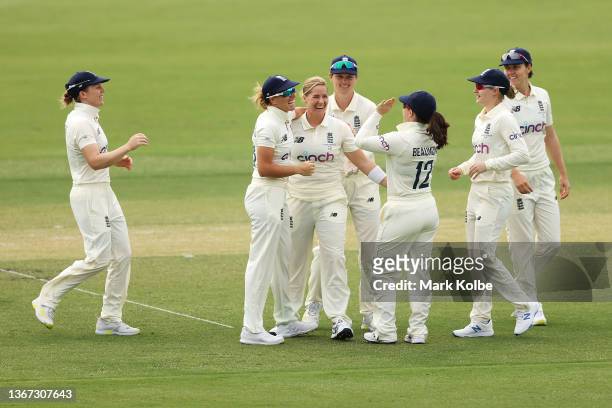 Katherine Brunt of England celebrates with her team after taking a wicket during day two of the Women's Test match in the Ashes series between...