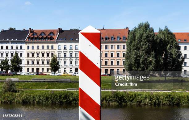polish boundary post in zgorzelec with view to görlitz - poland european union stock pictures, royalty-free photos & images
