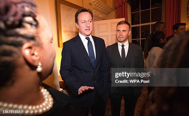 Prime Minister David Cameron and singer Gary Barlow attend a celebratory reception for BBC Children In Need hosted by Samantha Cameron at 10 Downing...