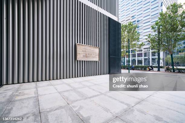 facade of a building in business district - brick pathway stock pictures, royalty-free photos & images