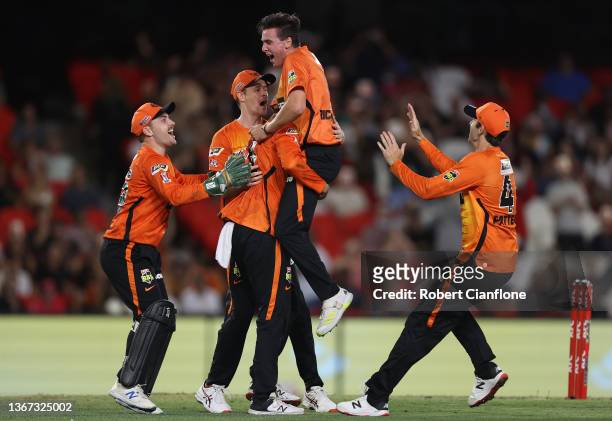 The Scorchers celebrate after they defeated the Sydney Sixers during the Men's Big Bash League match between the Perth Scorchers and the Sydney...