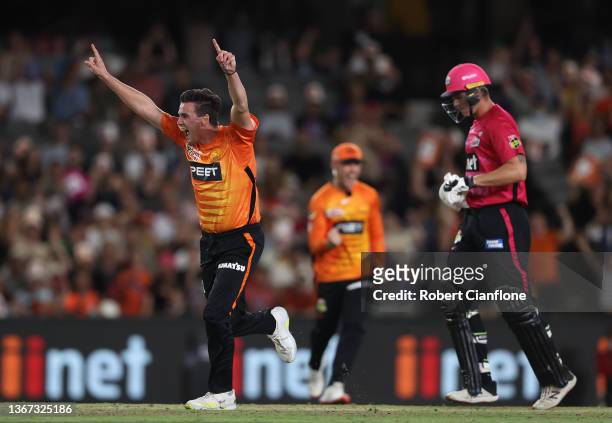 Jhye Richardson of the Scorchers celebrates taking the final wicket of Steve O'Keefe of the Sydney Sixers to win the Men's Big Bash League match...