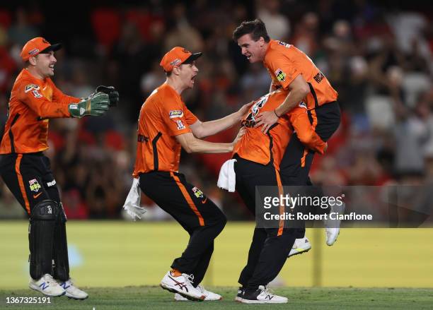 Jhye Richardson of the Scorchers celebrates taking the final wicket of Steve O'Keefe of the Sydney Sixers to win the Men's Big Bash League match...