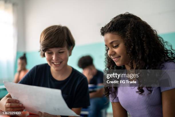 students reading in the classroom - girl desk stock pictures, royalty-free photos & images