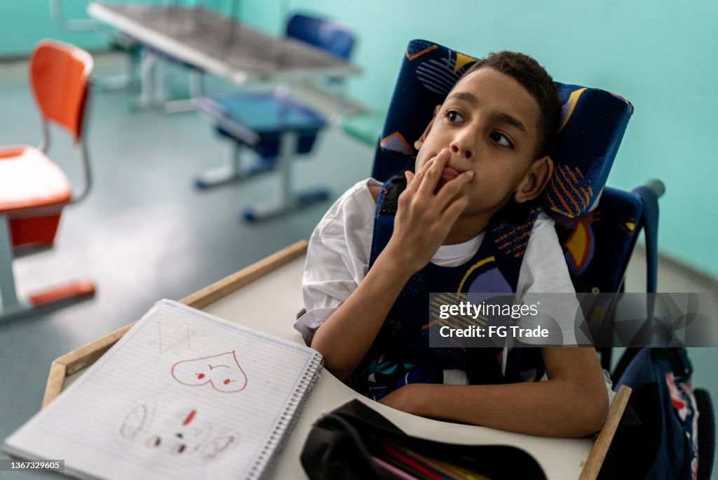 Boy with special needs in the classroom