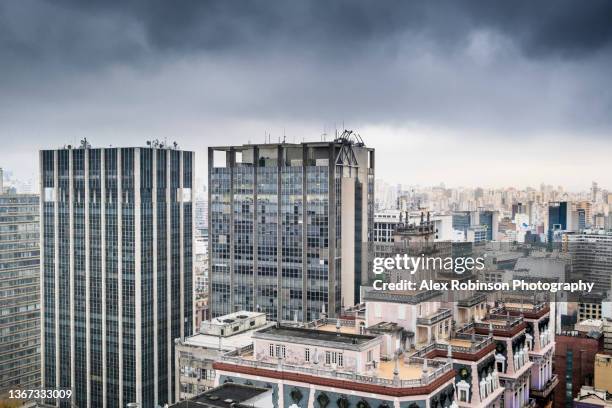 skyline view of downtown são paulo city under heavy rain clouds - rainy day in sao paulo stock pictures, royalty-free photos & images