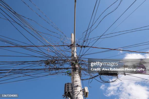 untidy electricity cables and junction boxes on a concrete post - street light post stock pictures, royalty-free photos & images