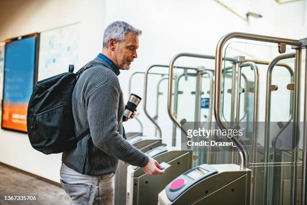 mature businessman commuting - public transportation stockfoto's en -beelden